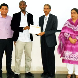 Mahdi Mohamud Sahal receiving a scientific research course certificate in Karachi, Pakistan