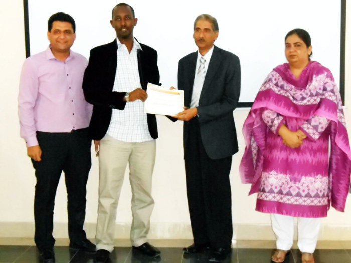 Mahdi Mohamud Sahal receiving a scientific research course certificate in Karachi, Pakistan