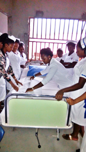 Teaching bed making at the Biaka University Institute of Buea, Cameroon - Mbivnjo Etheldreda Leinyuy