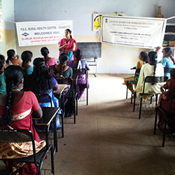 Dr. G. Subhashini addresses the tribal women in a health education session in Anaikatti village, India - Subhashini Ganesan