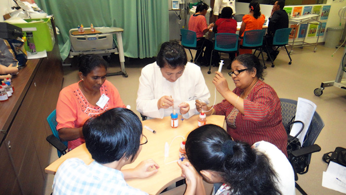 Practicing the umbilical cord catheterization procedure in a Singapore General Hospital simulation room - Yeshey Zangmo